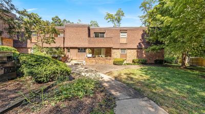 Multi unit property with a patio and a front yard | Image 1