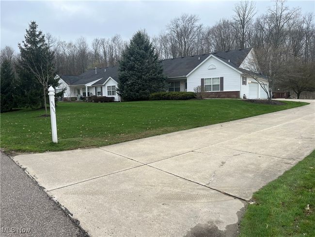 Large front yard and long driveway. Good thing the HOA takes care of cutting the grass and shoveling the snow. | Image 37