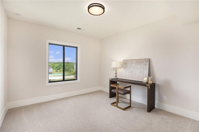 Office space with carpet flooring and baseboards | Image 31