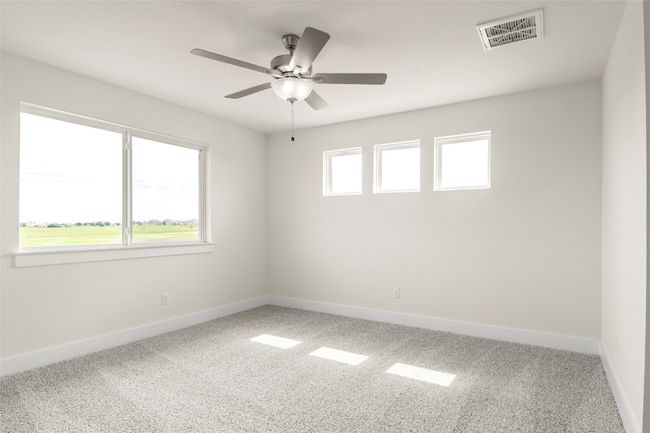 Carpeted empty room with visible vents, baseboards, and ceiling fan | Image 19