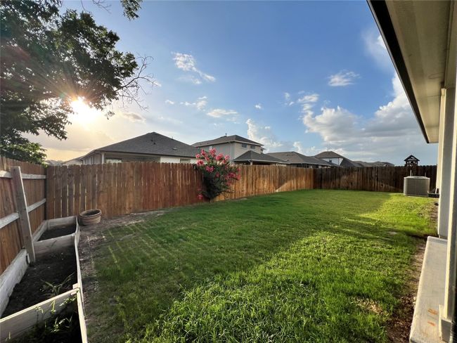 Yard at dusk featuring a fenced backyard | Image 14