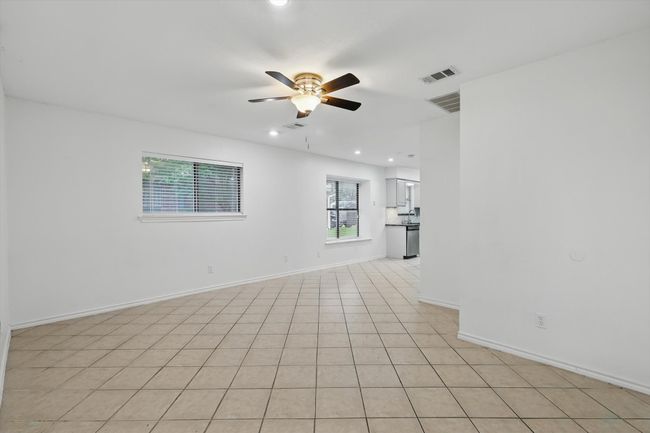 Unfurnished room featuring a ceiling fan, recessed lighting, and light tile patterned floors | Image 12