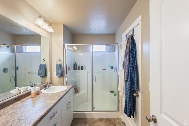 Full bathroom featuring vanity and a stall shower | Image 4