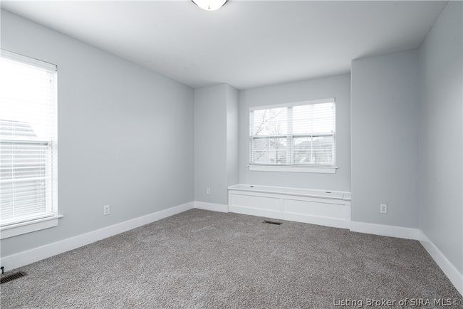 Bedroom 2 has 3 windows and a beautiful window seat that opens for additional storage! | Image 22