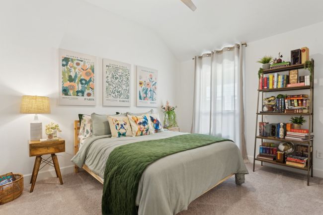 Carpeted bedroom featuring vaulted ceiling, baseboards, and a ceiling fan | Image 27