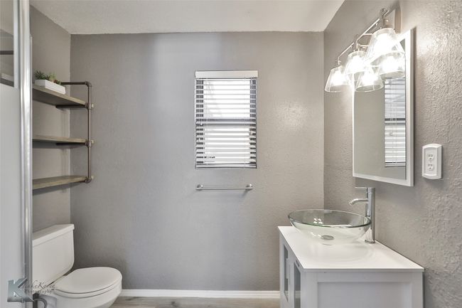 Bathroom featuring vanity and toilet | Image 13