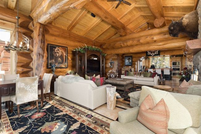 Great room from large windows and door to exterior deck. | Image 44