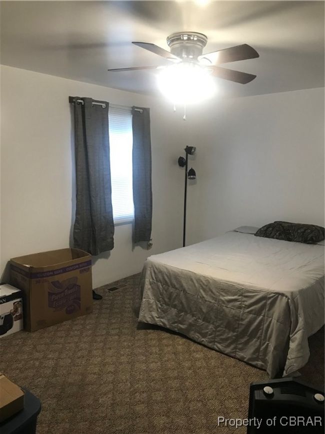 Bedroom featuring carpet and ceiling fan | Image 14