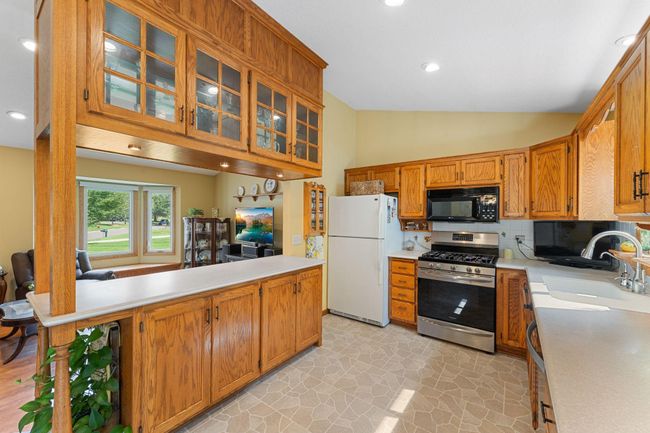 You'll love preparing meals for your family while still being present in this open space. | Image 11