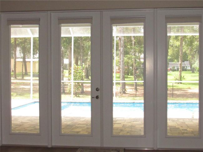 great room with pool access | Image 12