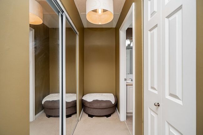 Corridor with light colored carpet and a sink | Image 15