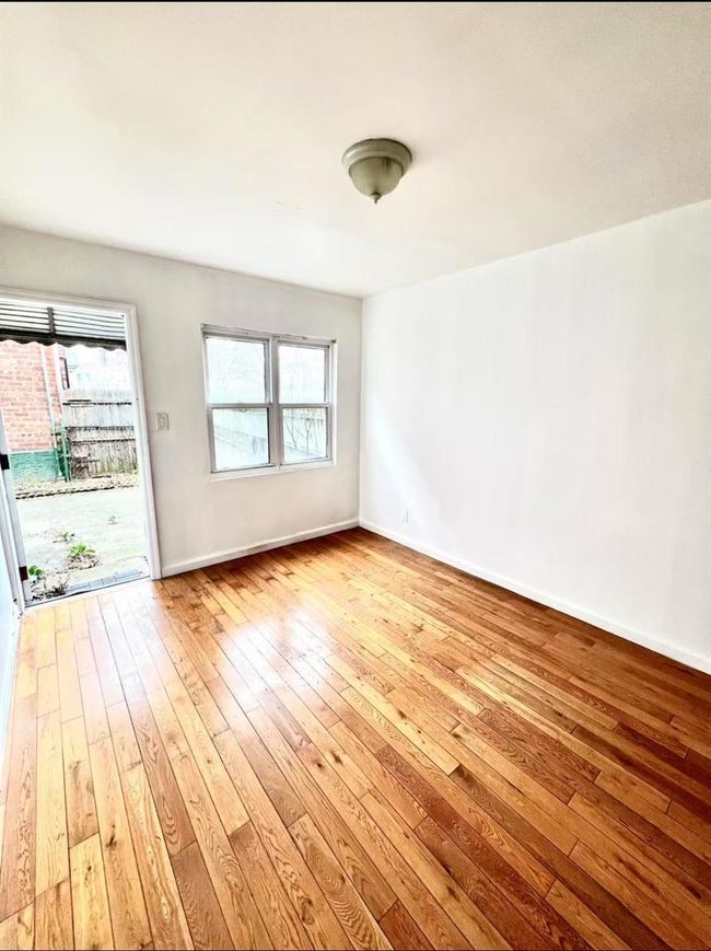 Empty room featuring plenty of natural light and light hardwood / wood-style flooring | Image 7