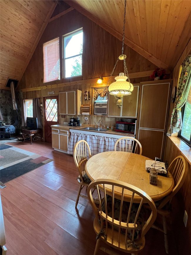 view from dining area to wood stove | Image 34