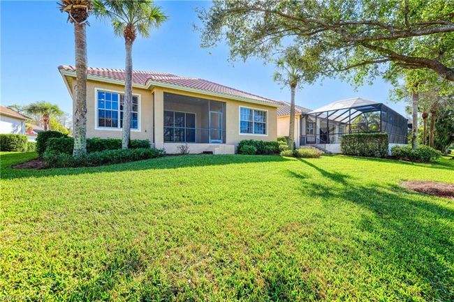 View of front of home featuring a lanai and a front yard | Image 42