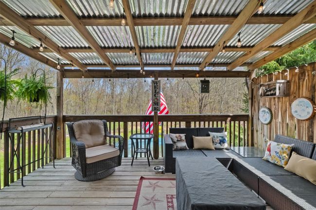 Wooden terrace featuring outdoor lounge area | Image 25