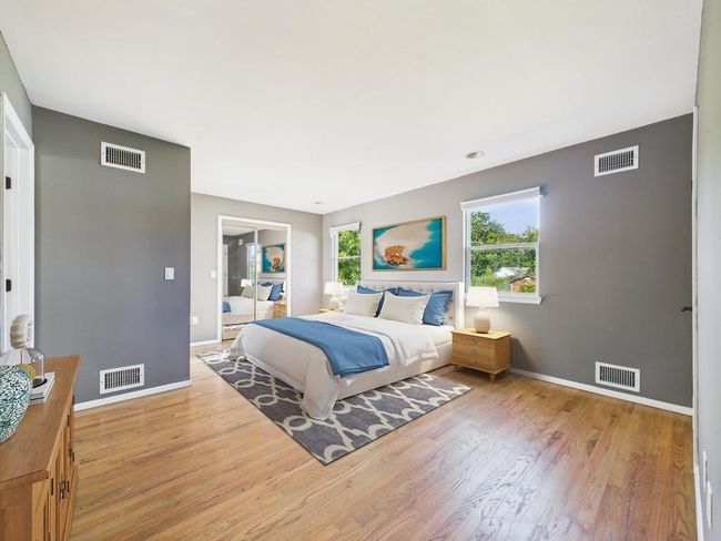 Bedroom featuring light wood-type flooring and baseboards | Image 21