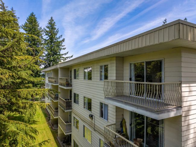View of home's exterior featuring a balcony | Image 4