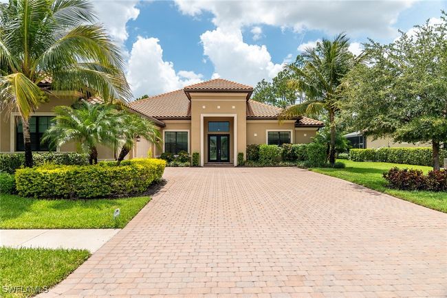 Mediterranean / spanish house with a tile roof, driveway, stucco siding, and french doors | Image 41