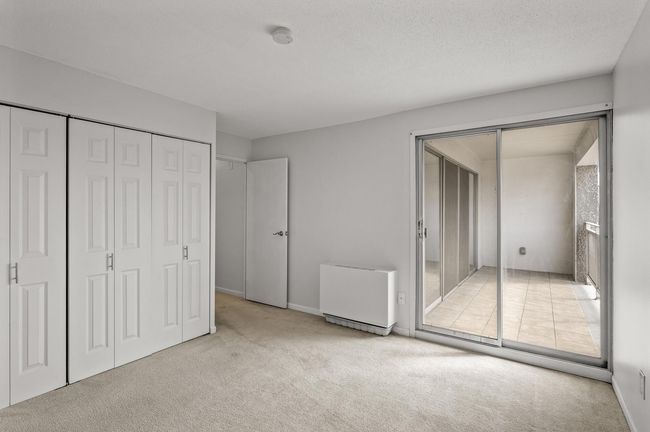 The 2nd bedroom steps out to the balcony | Image 24