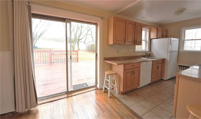 Kitchen SGD looking out to backyard. | Image 5