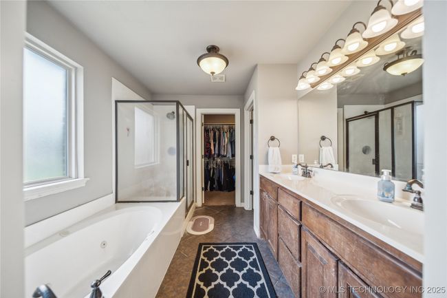 Primary bath leads to closet | Image 13