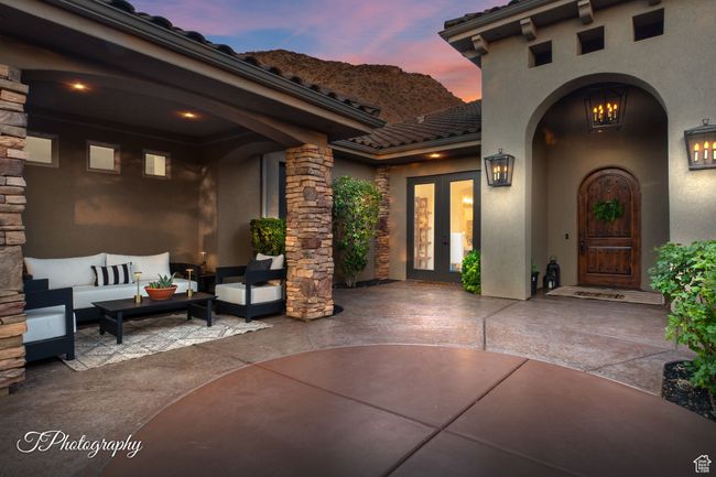 Patio terrace at dusk with french doors, a patio, and outdoor lounge area | Image 9