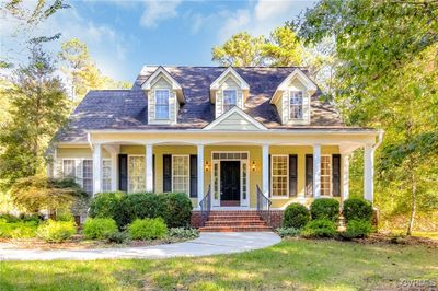 Cape cod house featuring covered porch | Image 3