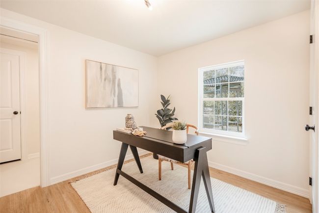 Home office featuring light wood finished floors and baseboards | Image 14
