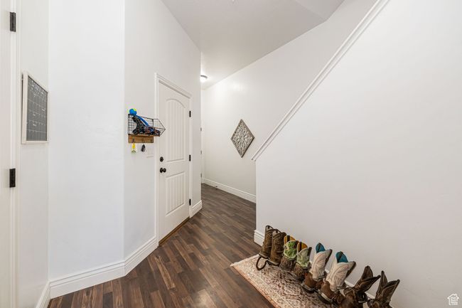 Entrance foyer featuring dark wood finished floors and baseboards | Image 4