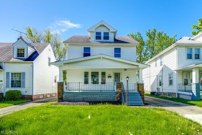 View of front of property with a porch and a front yard | Image 1