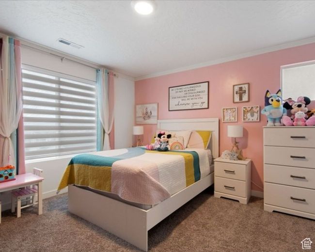 Carpeted bedroom featuring crown molding and baseboards | Image 12