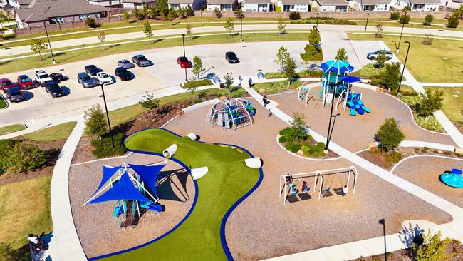 The neighborhood playground and park area offer plenty of room for kids to play and explore, creating the perfect backdrop for community gatherings and family fun. | Image 33