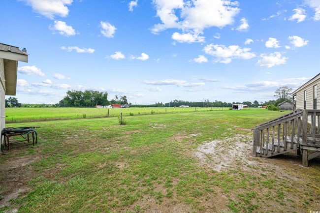 View of green lawn featuring a view of countryside | Image 28