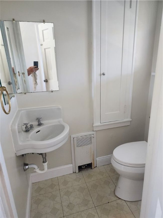 Cute little powder room privately located. Nice feature in older homes. | Image 16