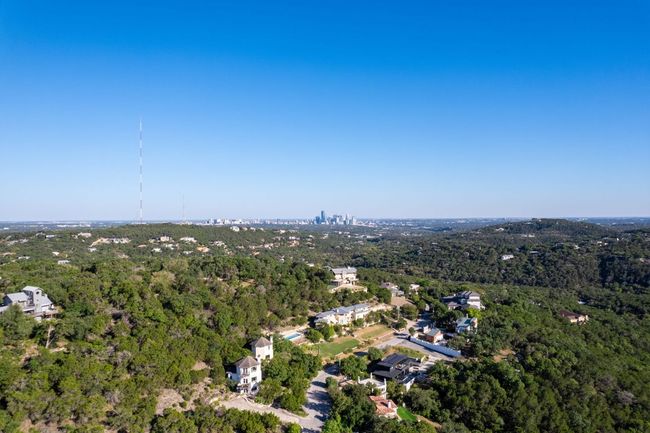 Aerial view of property and surrounding area with a heavily wooded area | Image 40