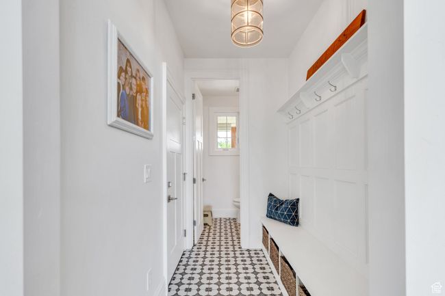 Mudroom featuring light flooring and baseboards | Image 26
