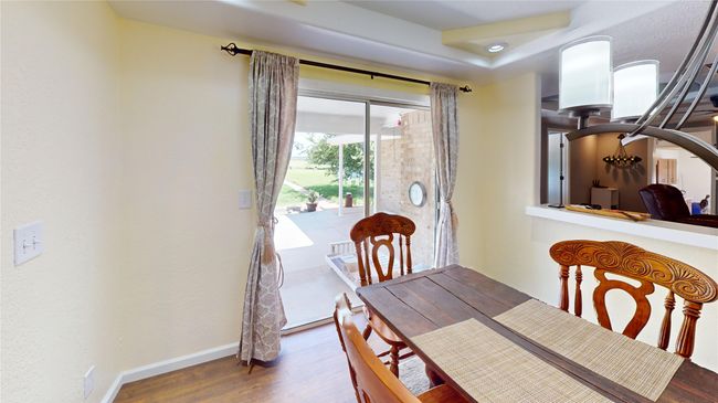 Dining space with dark wood-type flooring and recessed lighting | Image 13