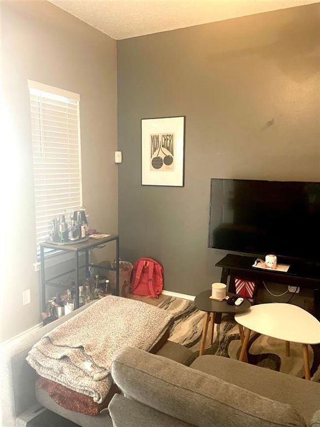 Living area with baseboards | Image 16