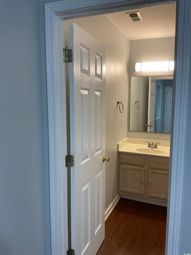 Bathroom with wood finished floors and vanity | Image 9