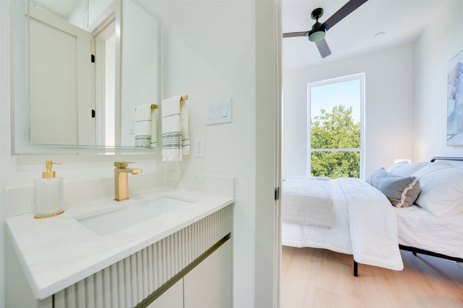 Bathroom featuring vanity, hardwood / wood-style flooring, and ceiling fan | Image 25