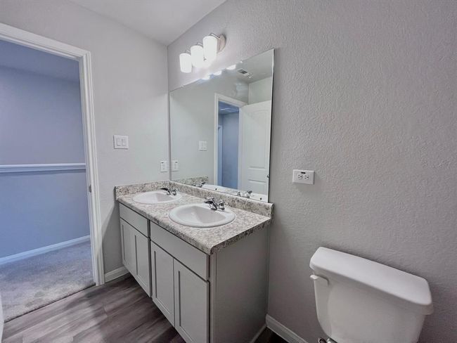 Elegant bathroom with a double sink vanity. Virtually staged for inspiration. | Image 33