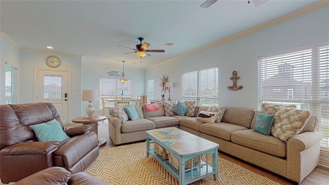 Additional view of the family room, featuring the entrance from your outdoor balcony. | Image 13