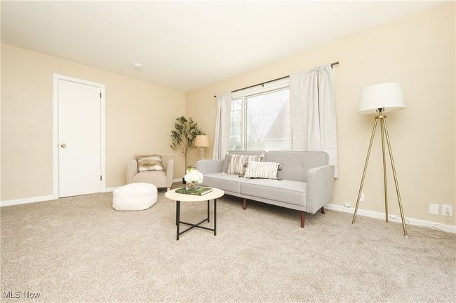 Carpeted living room with baseboards | Image 15