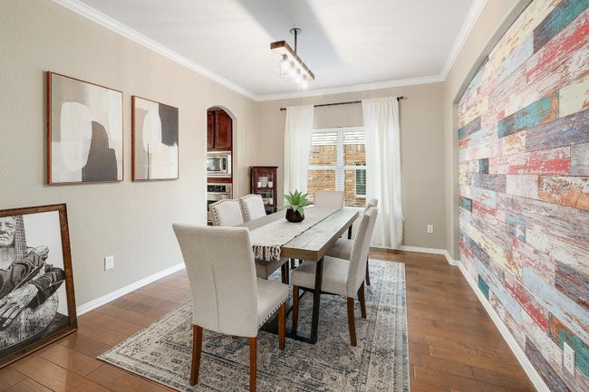 The formal dining room sets the stage for memorable meals, with plenty of space for hosting dinner parties and gatherings | Image 11