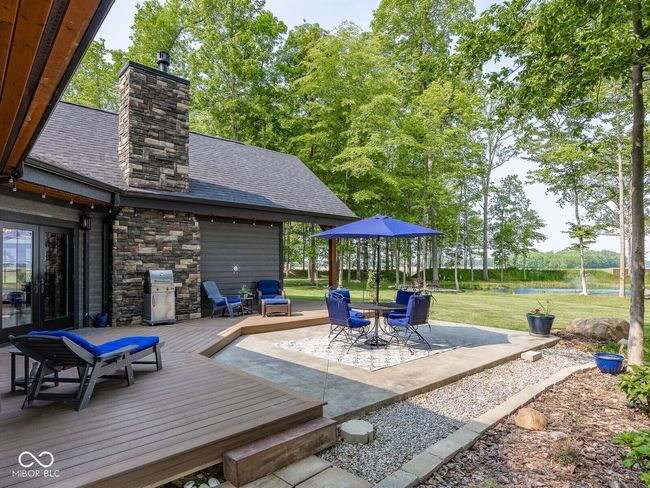 view of patio / terrace featuring a deck with water view and outdoor dining space | Image 39