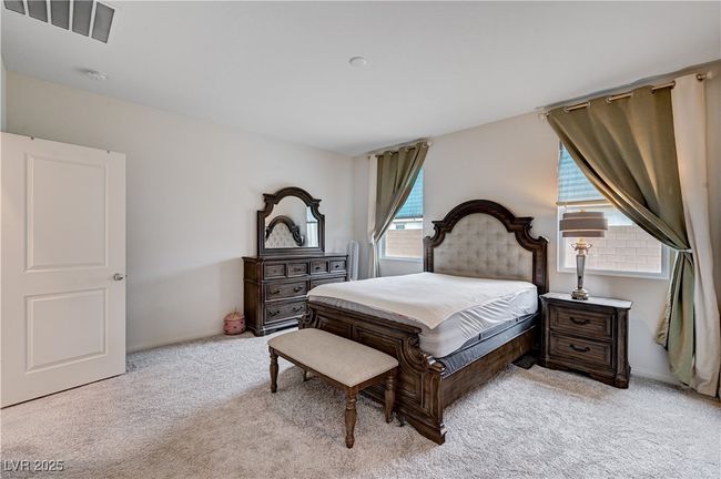 Bedroom featuring light carpet and baseboards | Image 20