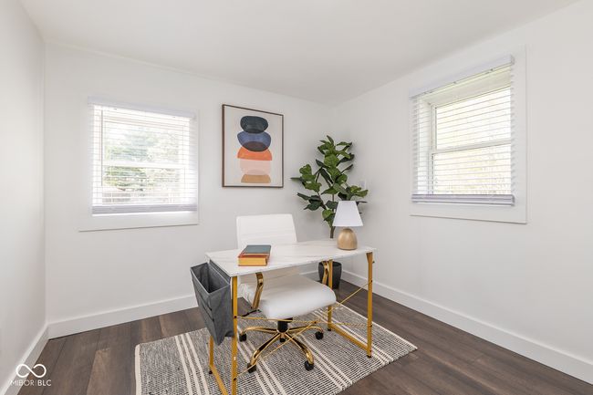 office space with baseboards, dark wood-type flooring, and a healthy amount of sunlight | Image 19