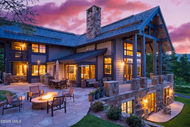 Multi-Sided Flagstone Patio with Panoramic Outdoor Space and a Built-In Gas Fire Pit. | Image 54