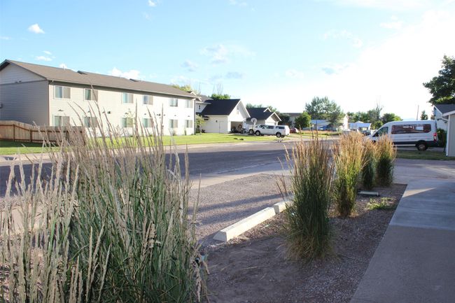 View of asphalt road featuring a residential view | Image 13