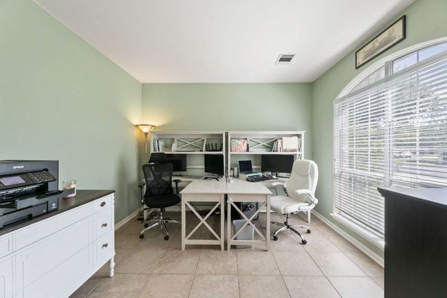 Office featuring baseboards and light tile patterned floors | Image 4